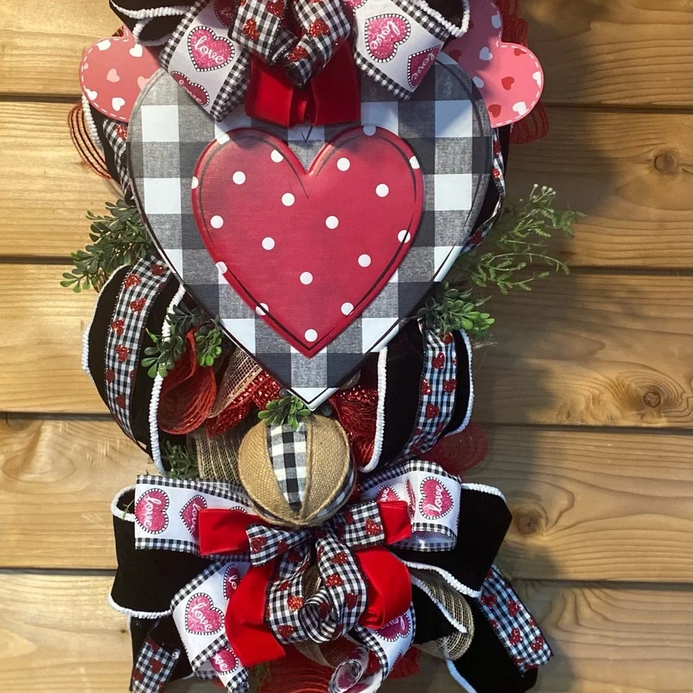 Heart-Themed Holiday Wreath with Red and Black Accents